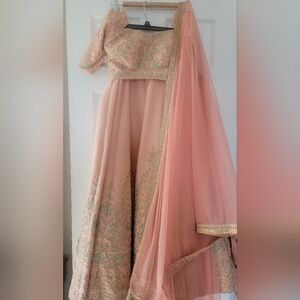 Elegant Peach Silk Lengha Choli with Gold Embroidery And Stone